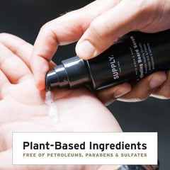 Hands applying Supply Beard Serum for even distribution
