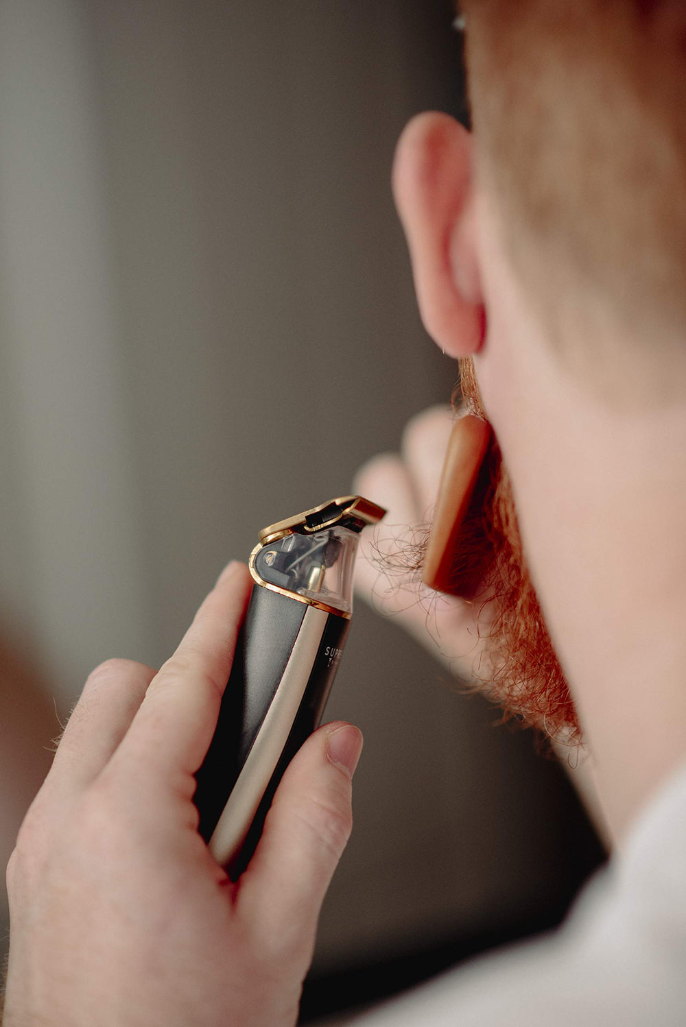 Supreme Trimmer packaging with included tools kit for complete grooming.