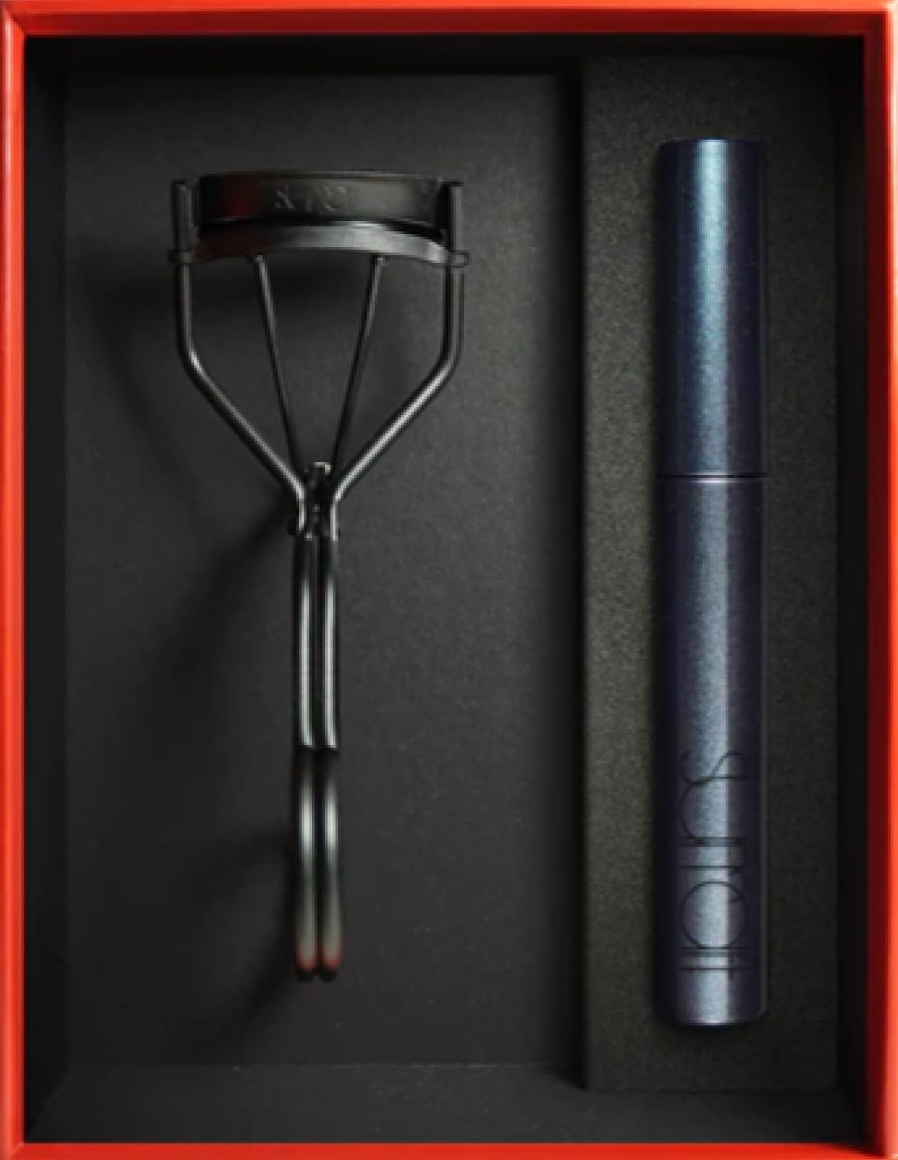 Close-up of Relevee Lash Curler in polished metal
