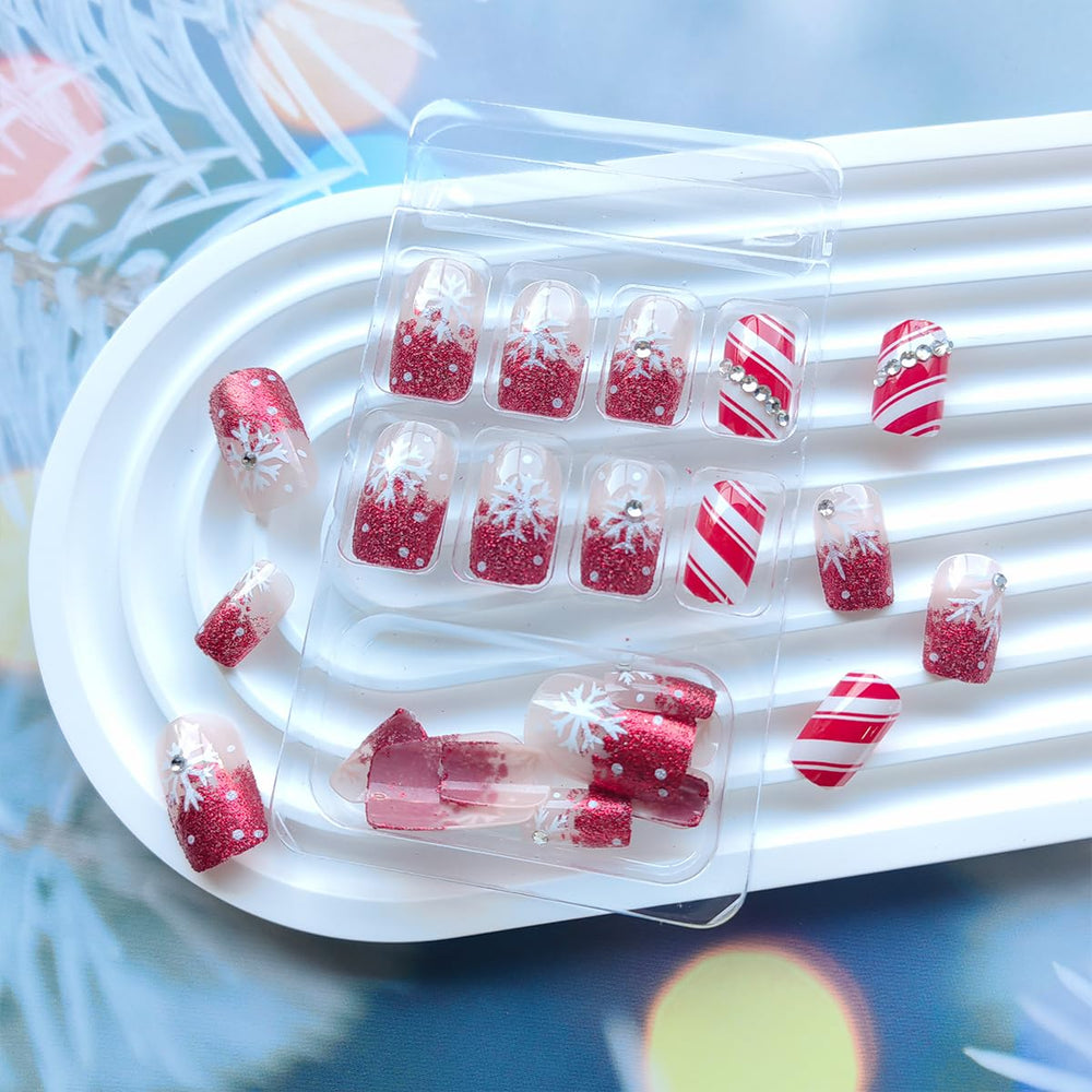 Sutaozhi red French tip nails with sparkling accents for party-ready style.