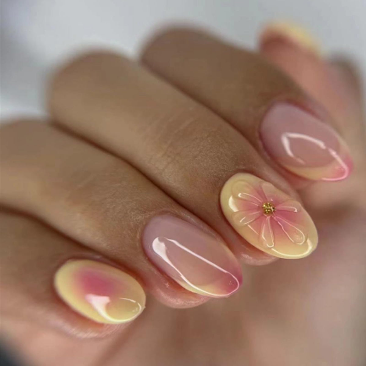 SWEKKE short almond nails with French tip and 3D flower design for stylish everyday use.