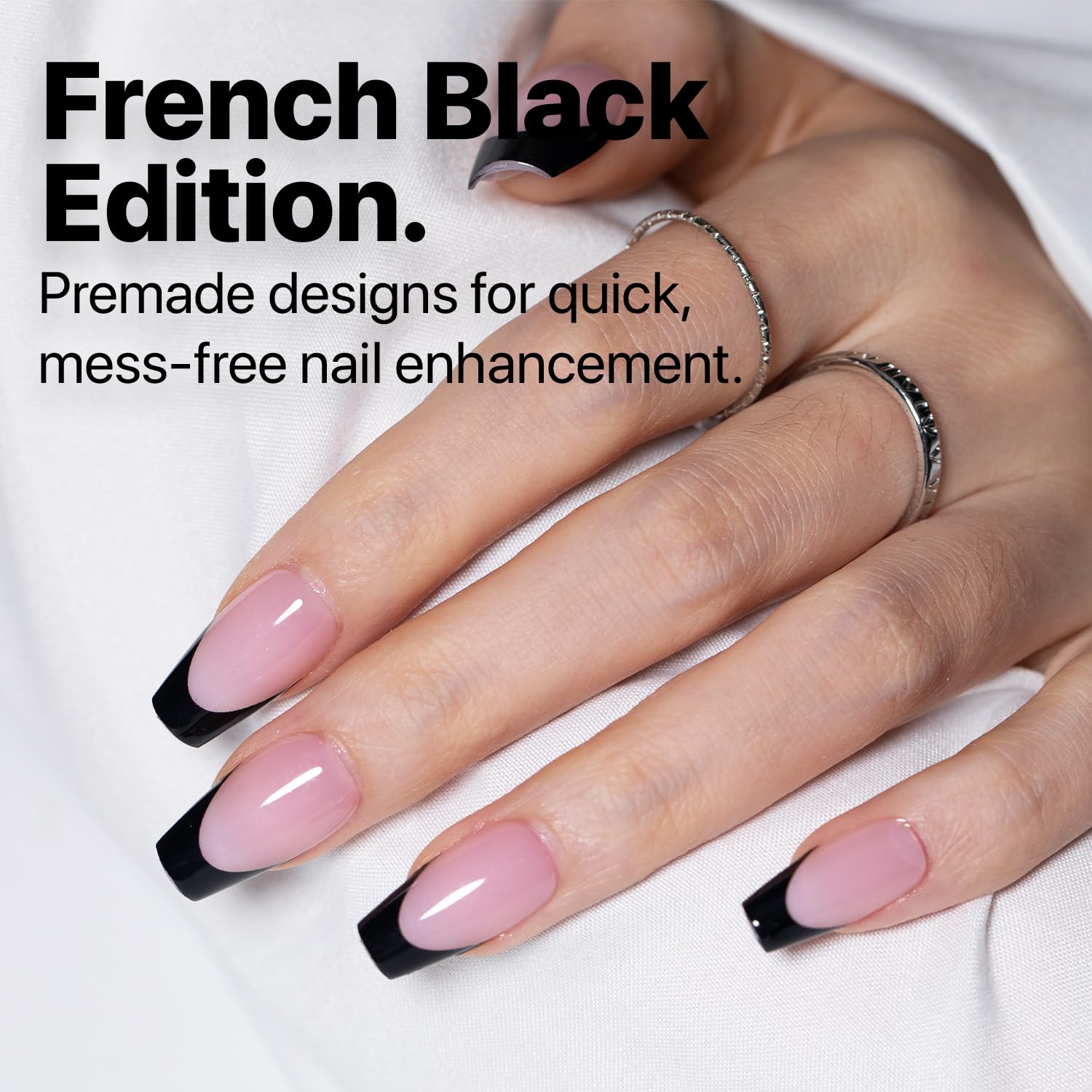 SXC Black Series nails on a hand display a quick, salon-like French tip look