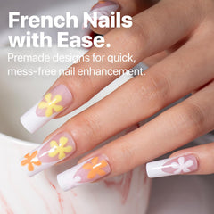 SXC pink French-tip nails close-up showing delicate design for versatile everyday wear.