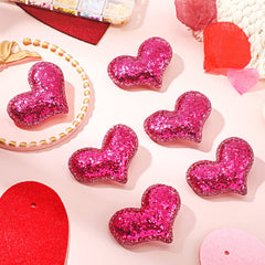 Syhood glitter sequin heart clip rose red worn in a chic hairstyle.