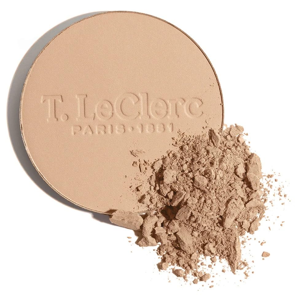 Brush applying T. LeClerc Rice Compact Powder for a smooth texture.