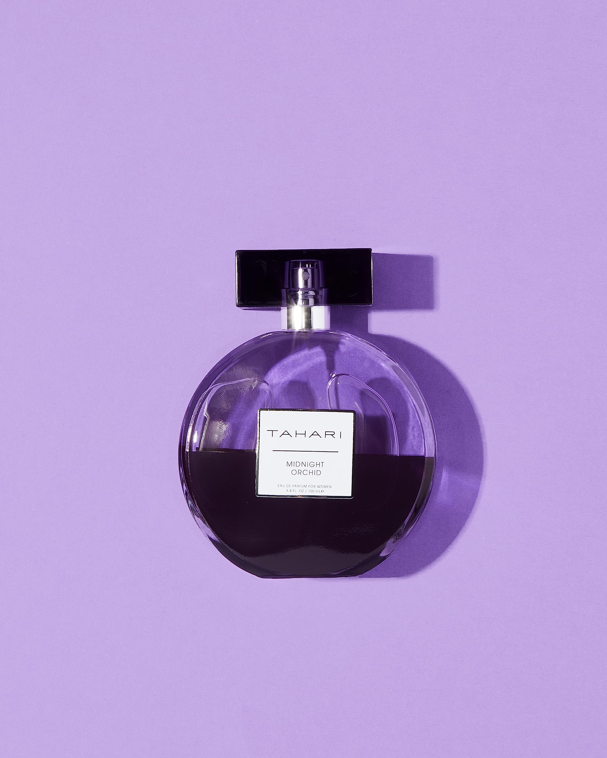TAHARI Midnight Orchid bottle close-up highlighting orchid and vanilla notes for depth.
