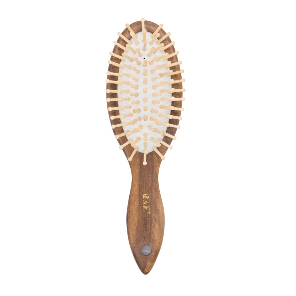 Tan Mujiang hair brush with teak handle for smooth detangling and nourished hair
