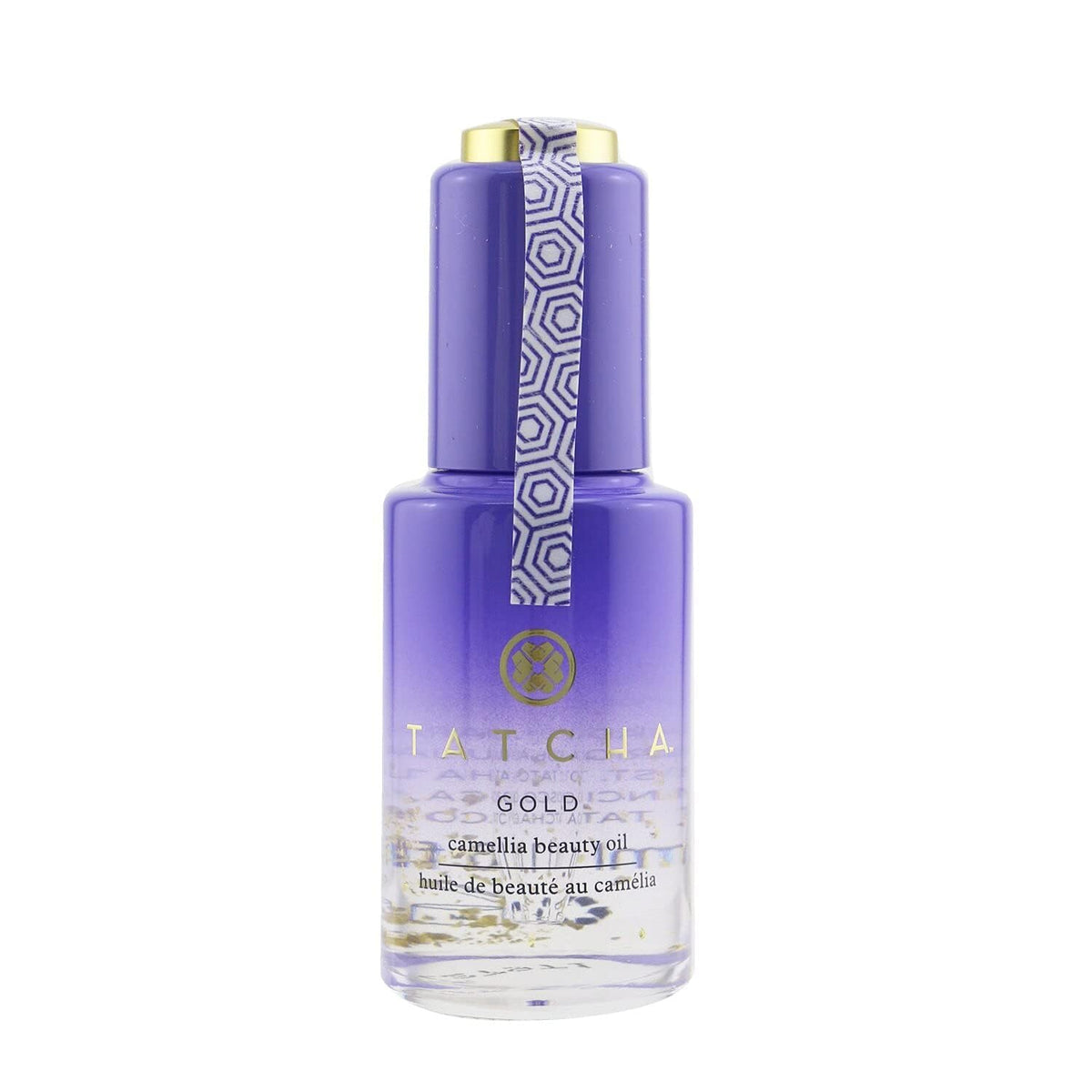 TATCHA Gold Camellia Beauty Oil bottle close-up with 23k gold flakes for radiant glow.