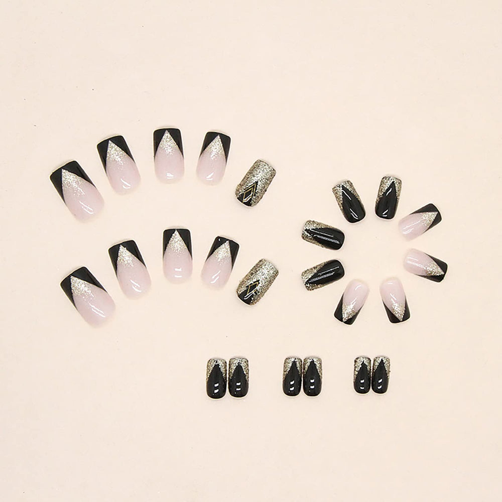 TBRZTR glossy glue-on nails: full-cover nude with black and gold accents.