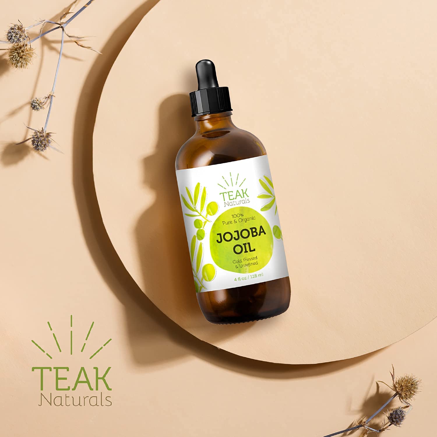 Teak Naturals Jojoba Oil bottle with dropper, ideal carrier for essential oils.