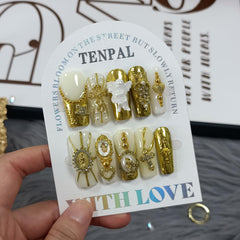 TENPAL Baroque nails with gold glam cross charm for elegant events