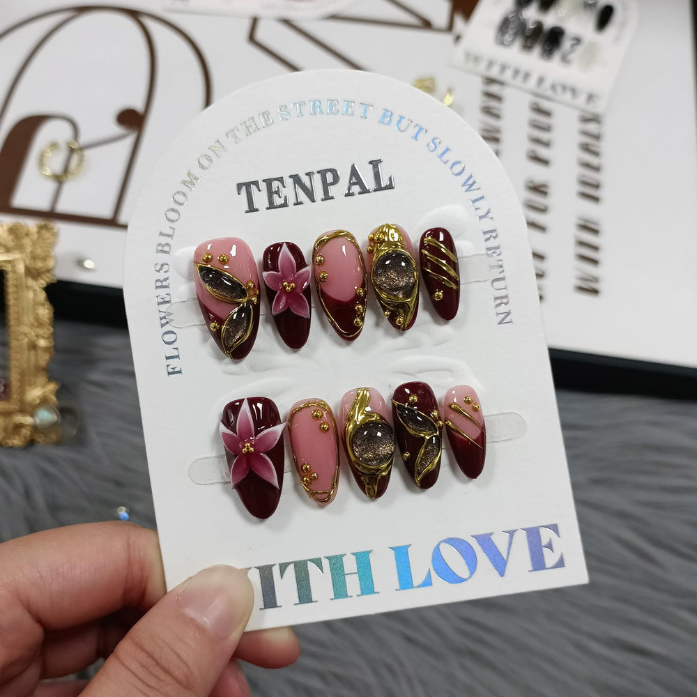 TENPAL Burgundy cat-eye nails close-up showcases rich color and embossed texture.
