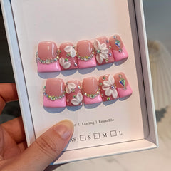 TENPAL nails with 3D flowers and diamond accents for standout style.