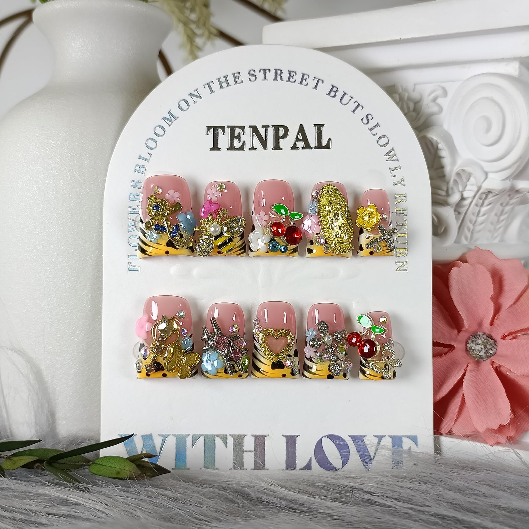 TENPAL duckbill nails with pale-yellow French tip and 3D bee and fairy charms.