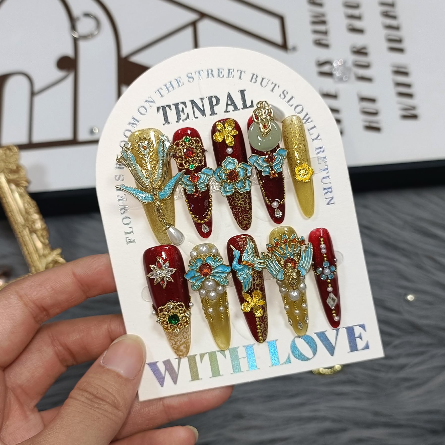 TENPAL long stiletto nails with crystal embellishments for a luxurious look.