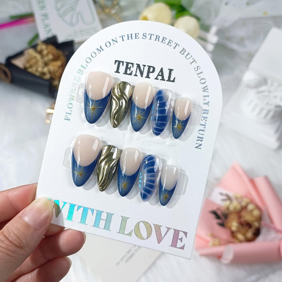 TENPAL metallic nails with crocodile star pattern for a bold, shimmering manicure accent.