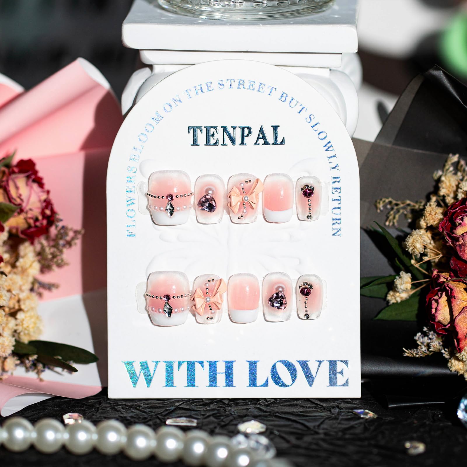 TENPAL beads and pearls embellish nails for subtle elegance at celebrations.