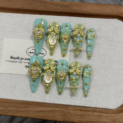 TENPAL stiletto nails mint green baroque with 3D cross bow star for bold party glam