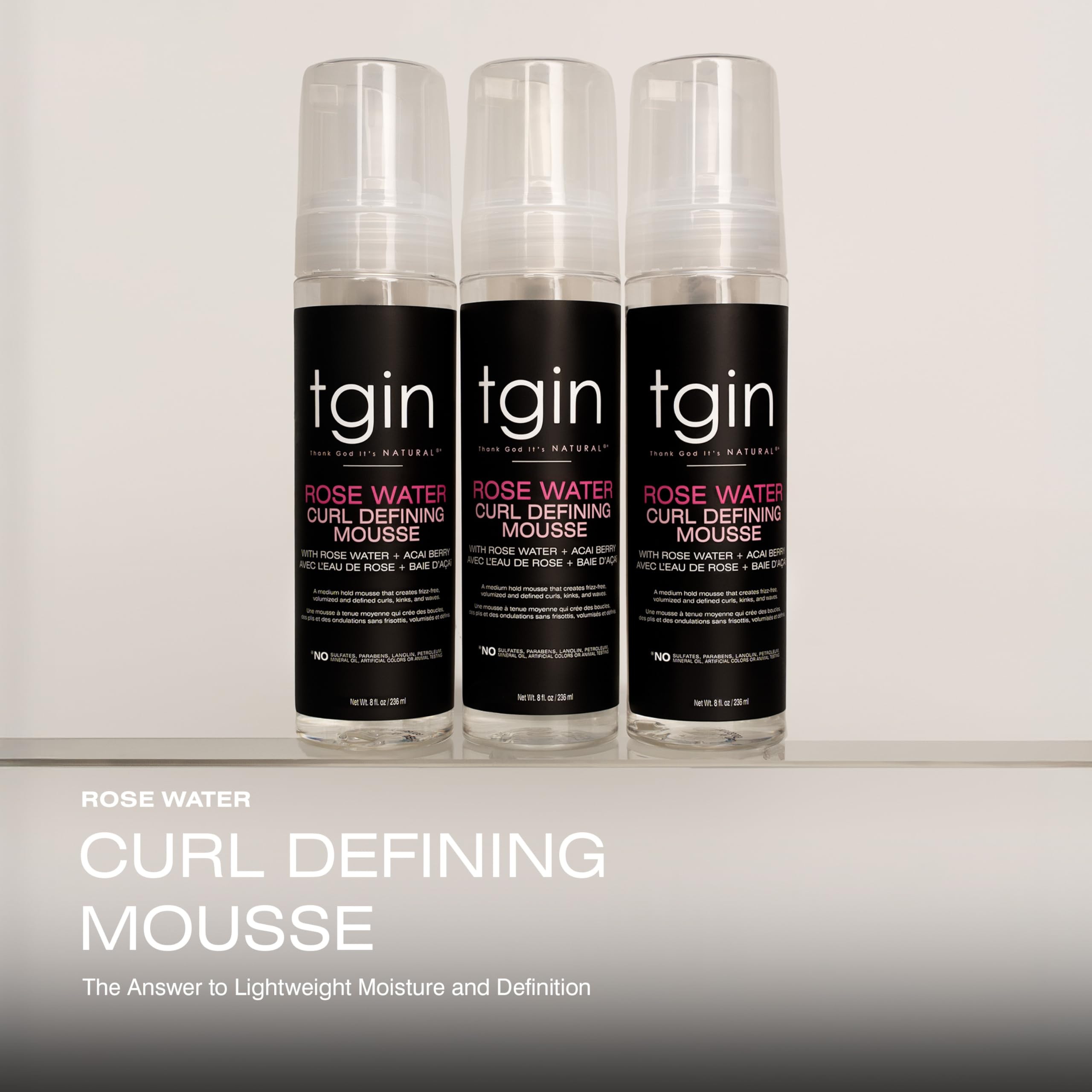 tgin Rose Water Curl Defining Mousse dispensing close-up demonstrating smooth application for manageable curls