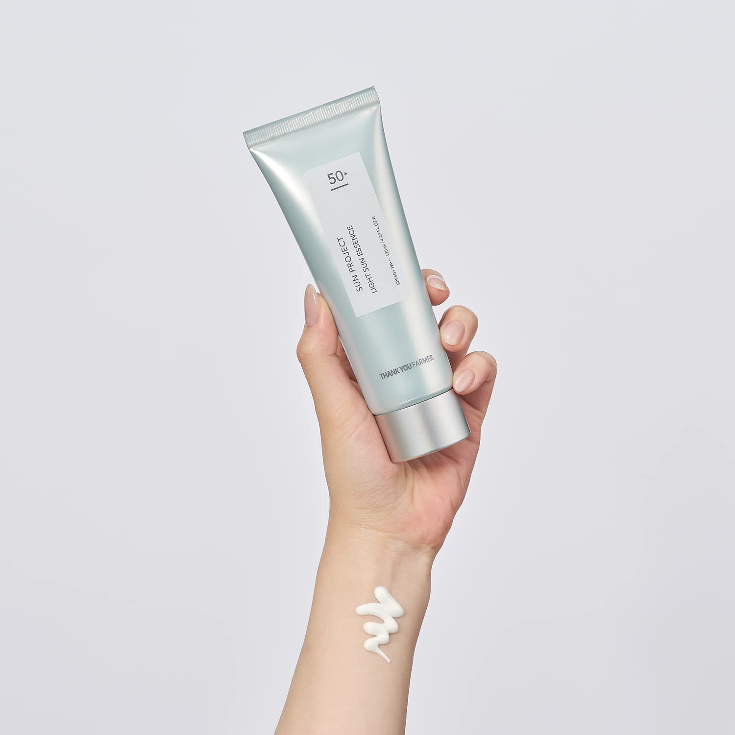 THANKYOU FARMER Sun Project Light Sun Essence texture as it pours for hydration.