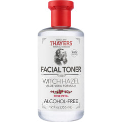 THAYERS Witch Hazel non-distilled extract droplets on skin, balancing pores.