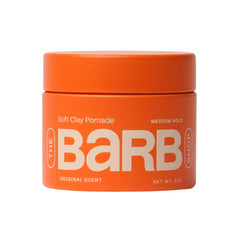 The Barb Shop Barb Soft Clay Pomade jar closeup showing medium hold for versatile styling.