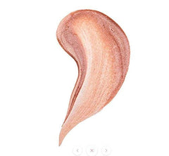 The Beauty Crop Glow Milk Dropper applied to the cheekbones for a luminous highlight