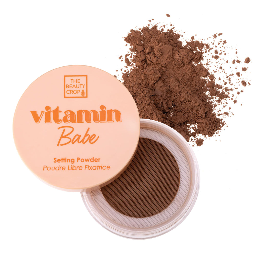 The Beauty Crop Vitamin Babe Setting Powder packaging with puff for quick touch-ups.