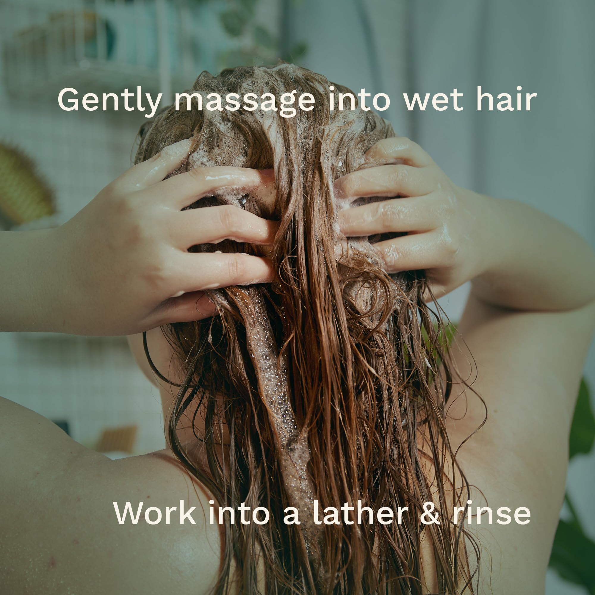 Hands applying The Body Shop Banana Shampoo to hair during wash
