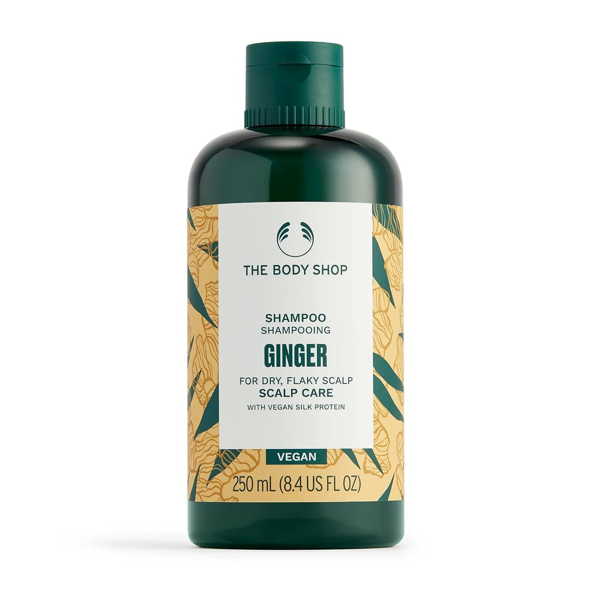 The Body Shop Ginger Anti Dandruff Shampoo bottle close-up for scalp refresh.