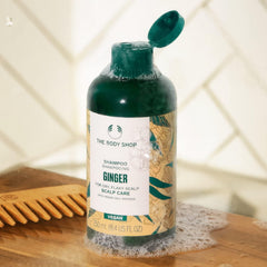 The Body Shop Ginger Anti Dandruff Shampoo lathering on hair during wash.