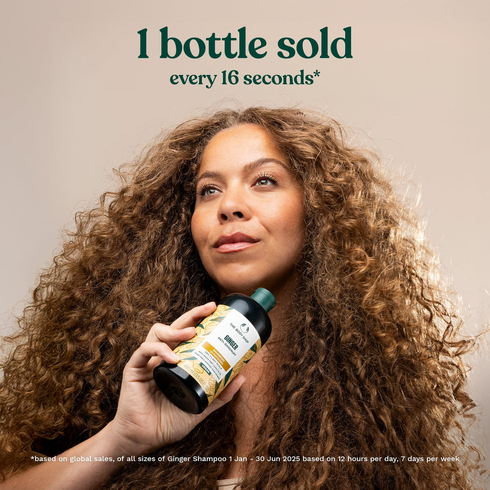 The Body Shop Ginger Scalp Care Shampoo foamy lather in hand