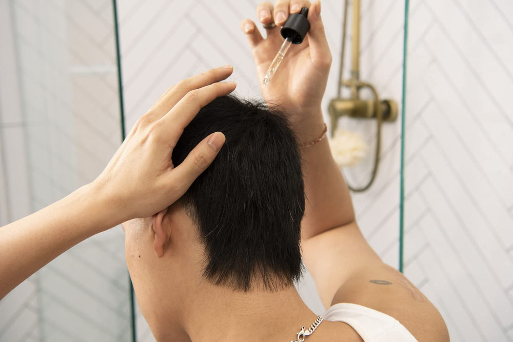 The Body Shop Ginger Scalp Serum texture shown for even application on scalp