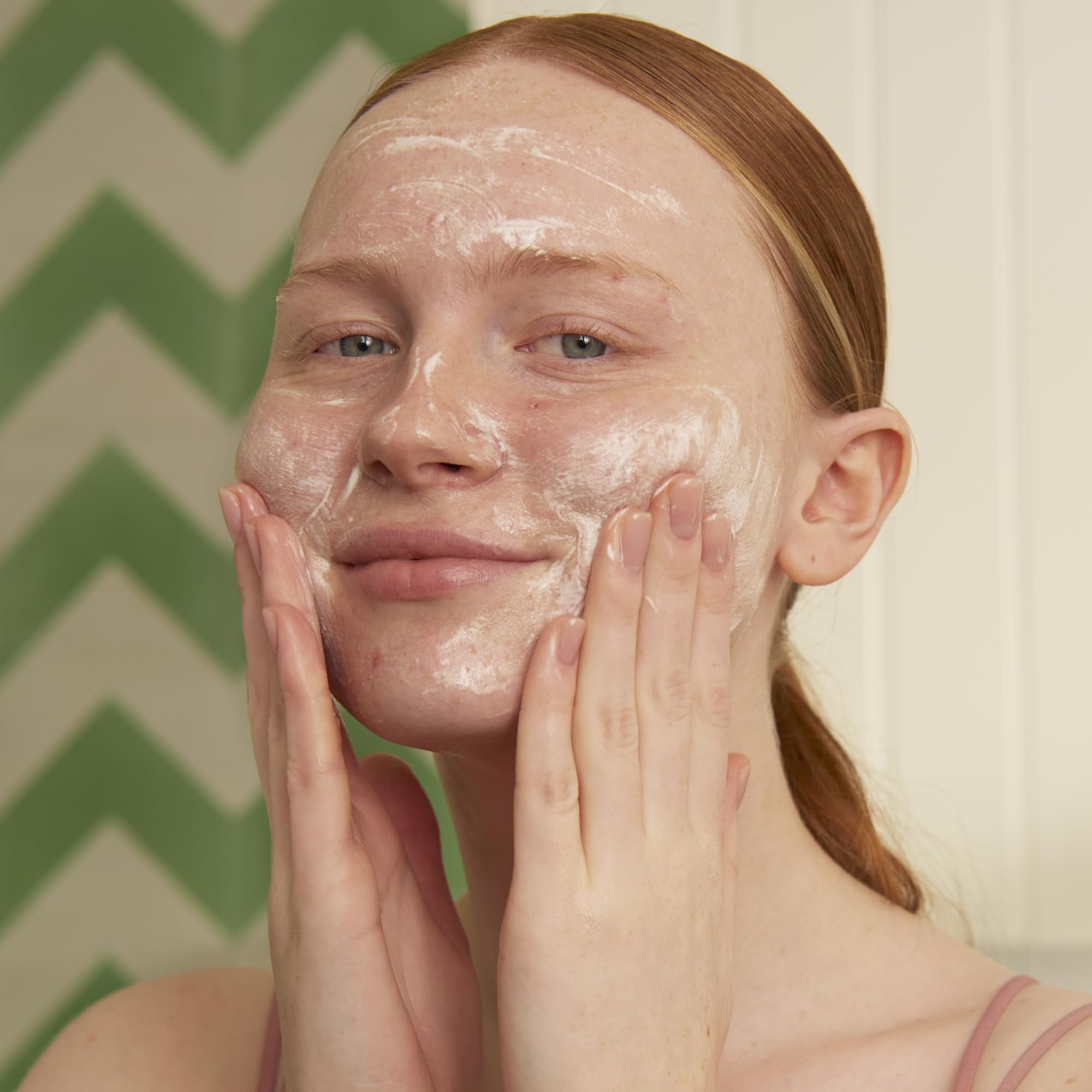 Close-up of foam texture from The Body Shop Tea Tree cleanser lather.