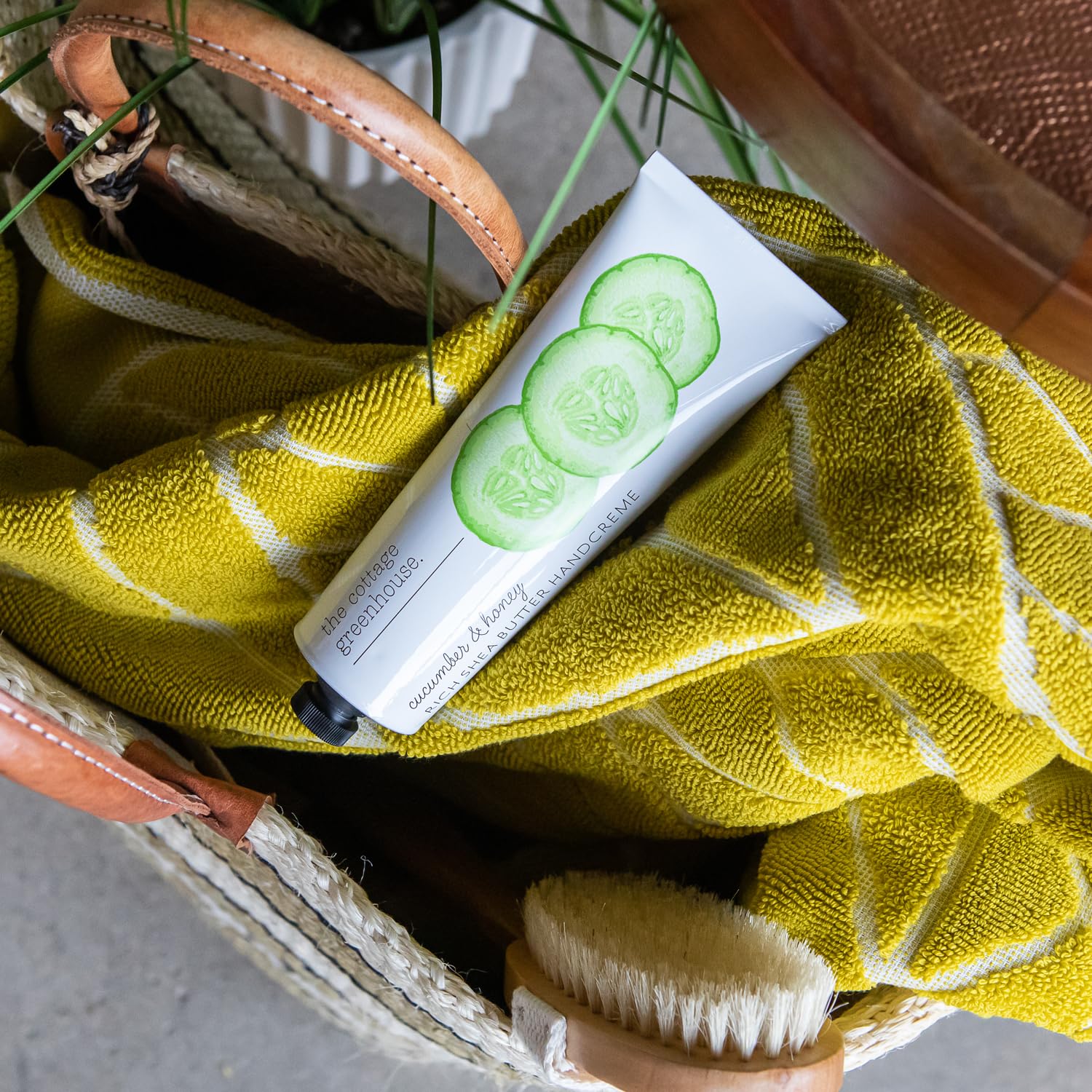 Close-up of packaging for The Cottage Greenhouse cucumber-honey handcreme.