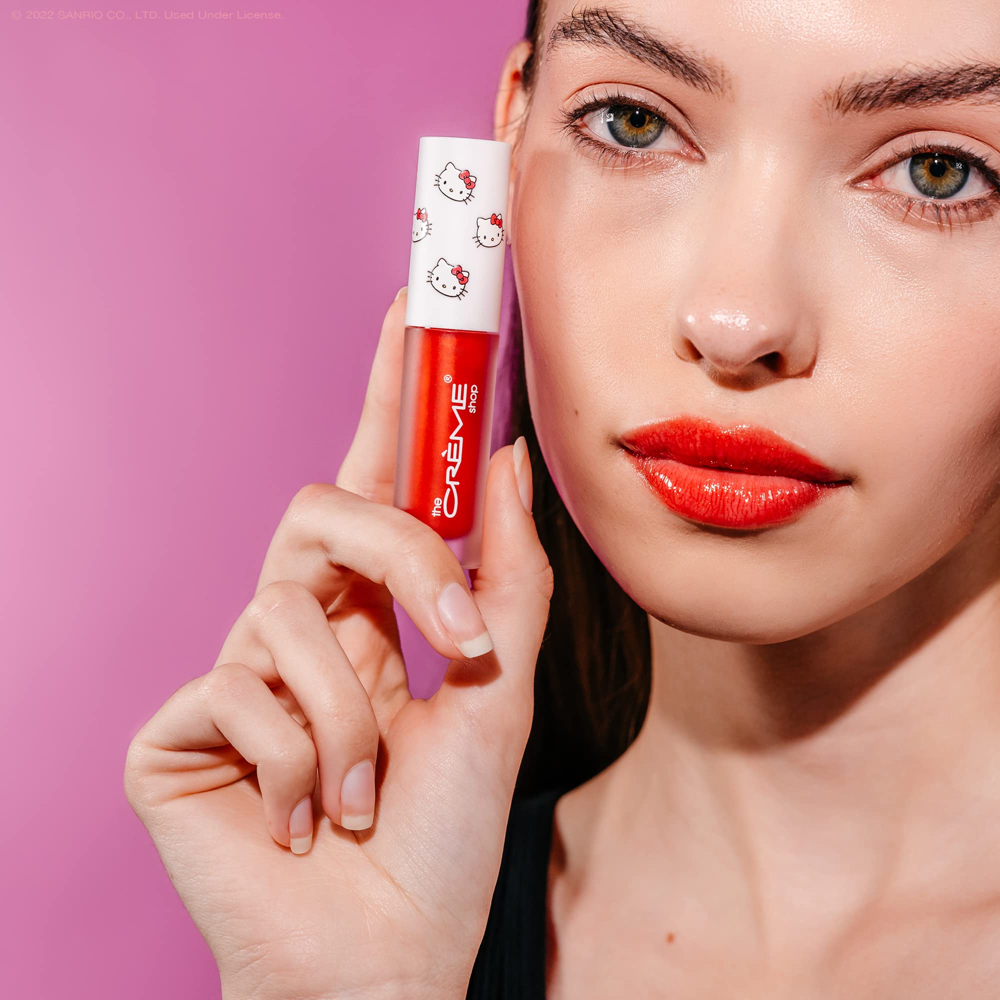 The Crème Shop Hello Kitty Kawaii Kiss Lip Oil apple glossy sheen for a luminous pout.