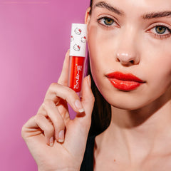 The Crème Shop Hello Kitty Kawaii Kiss Lip Oil apple glossy sheen for a luminous pout.