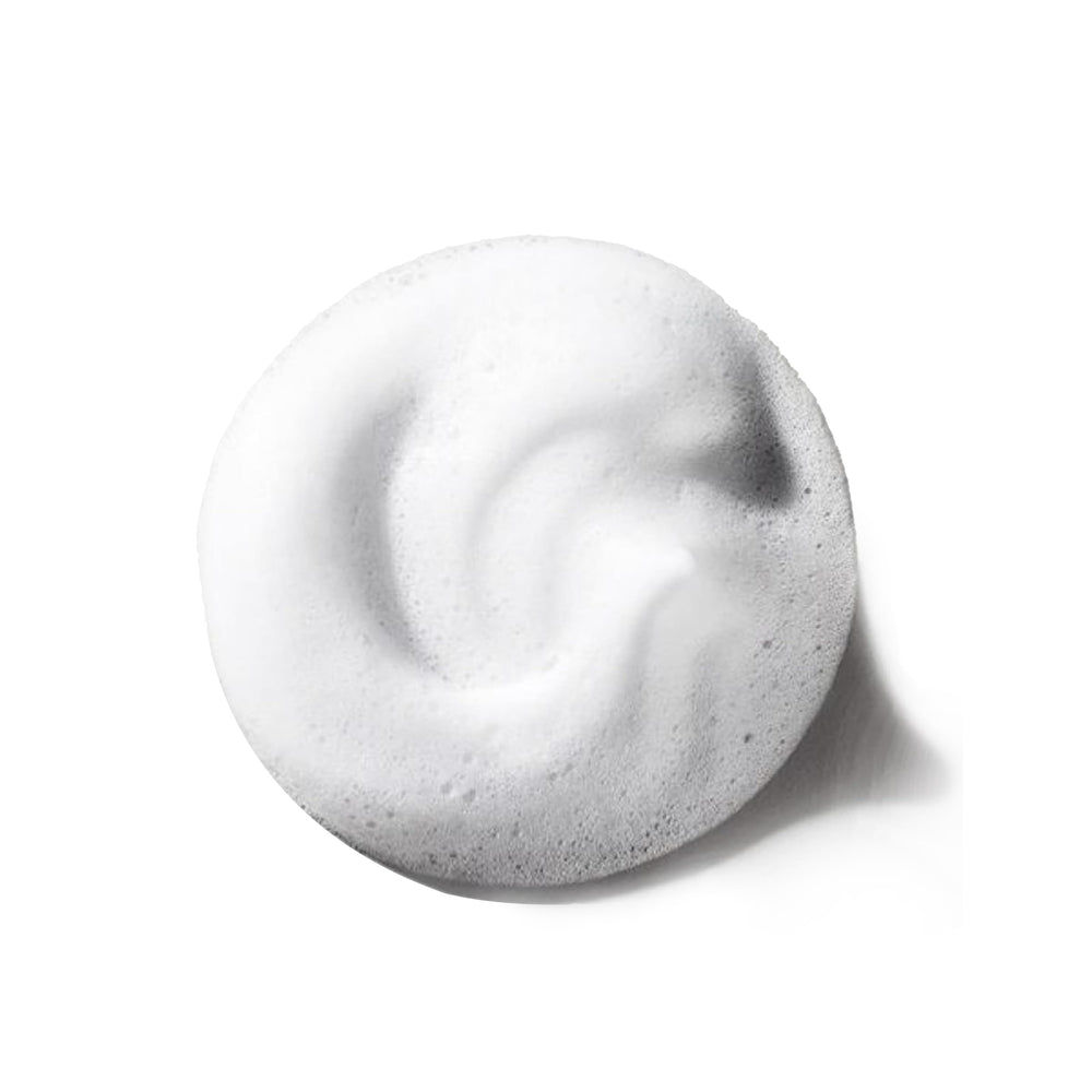 The Doux Chief Rocka Mousse on shiny curls enhances frizz control and natural shine.