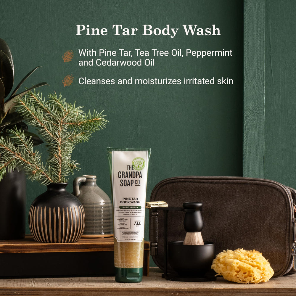 The Grandpa Soap Company Pine Tar Body Wash bottle close-up highlights tea tree and cedarwood oils for cleansing.