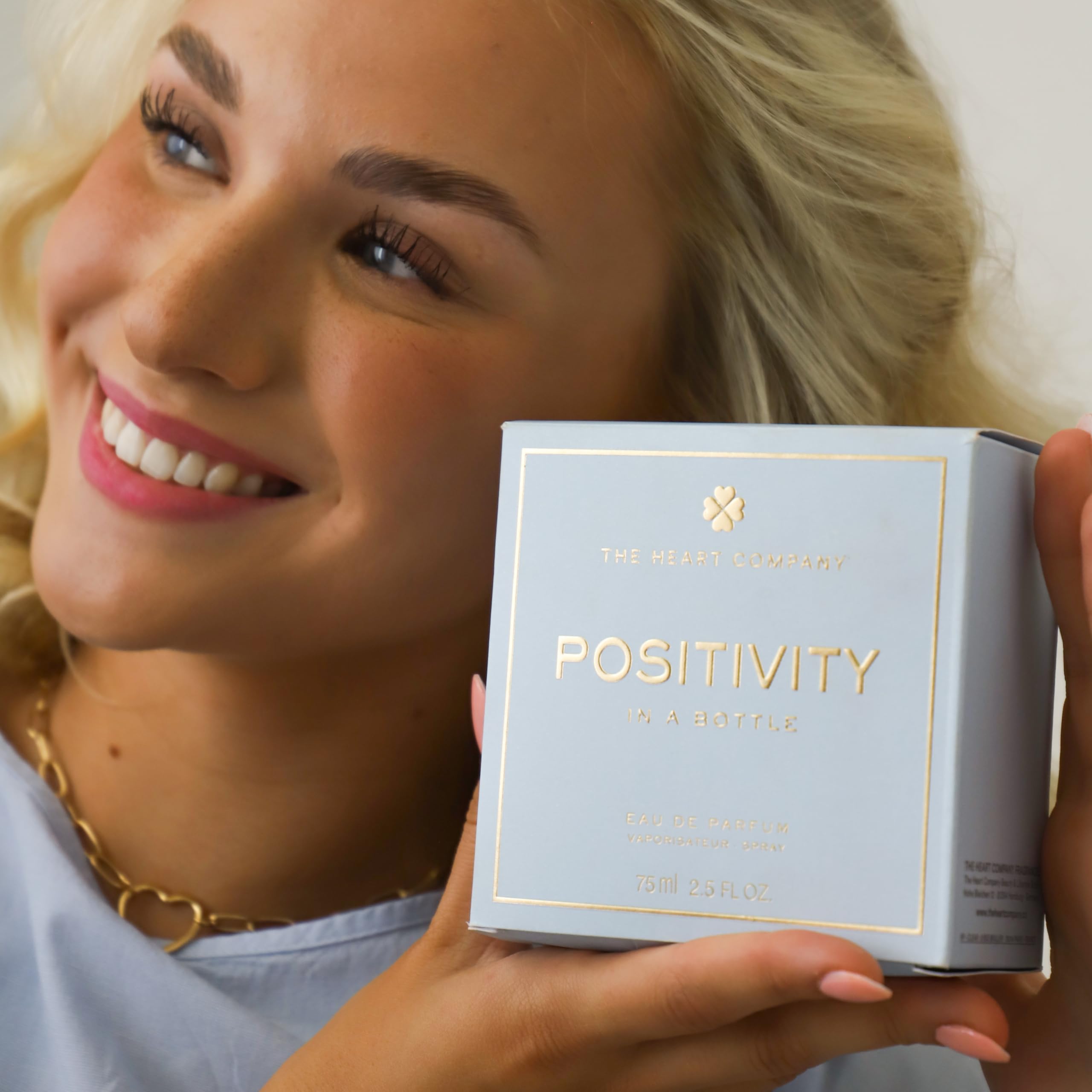 The Heart Company Positivity beach-scene bottle evokes ocean air and calm mood.