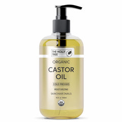 The Holly Tree Organic Castor Oil bottle pour showing pure, versatile oil for skin and hair