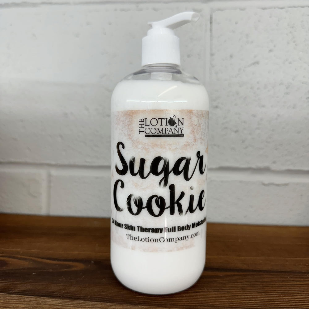 The Lotion Company Sugar Cookie lotion hands-application demonstrates easy full-body use.