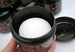 Close-up texture of The Magic Pads wipes showing exfoliation surface