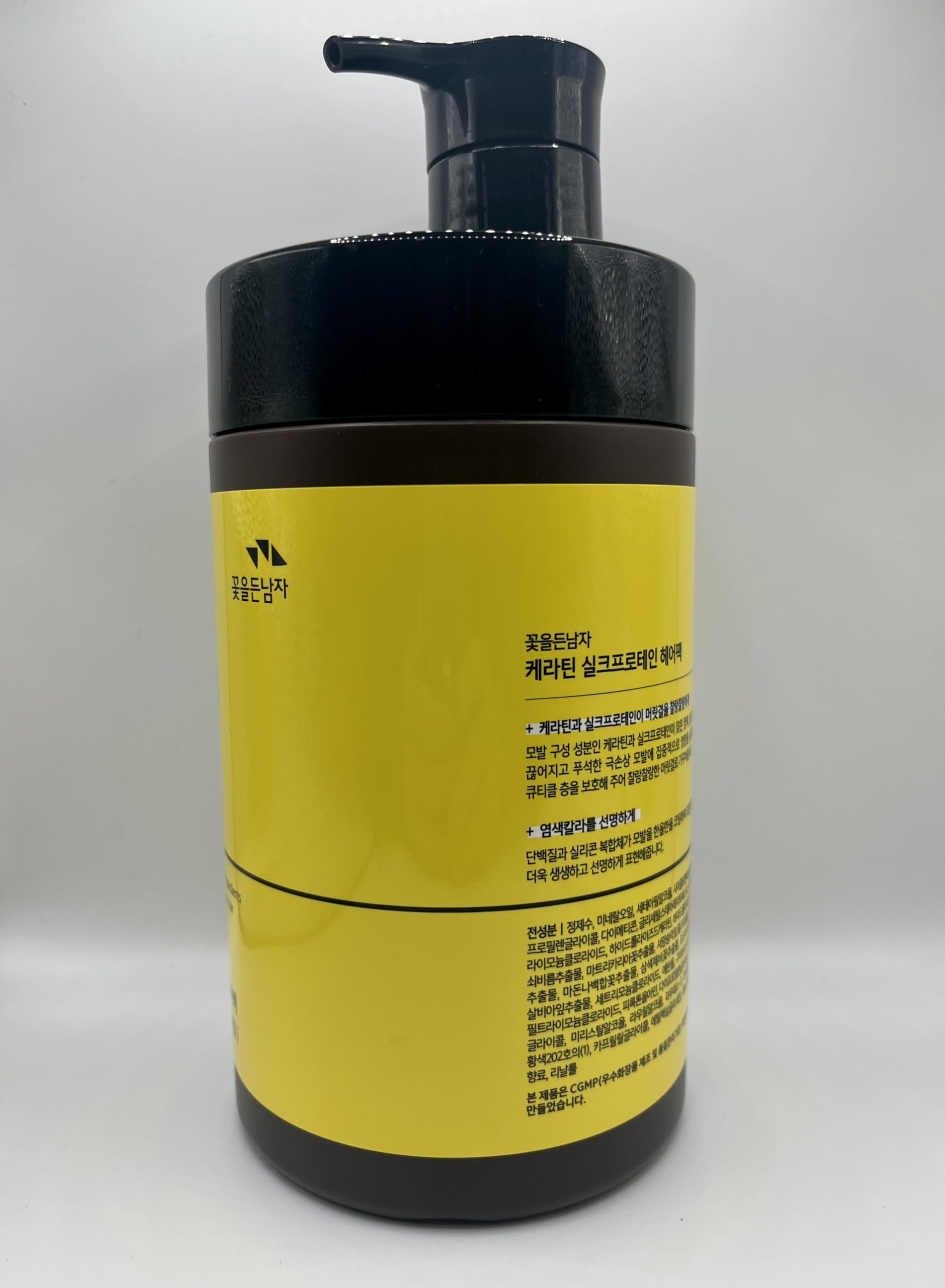 The Man Company Man with Flowers keratin silkprotein hair pack application demonstrates easy at-home care.