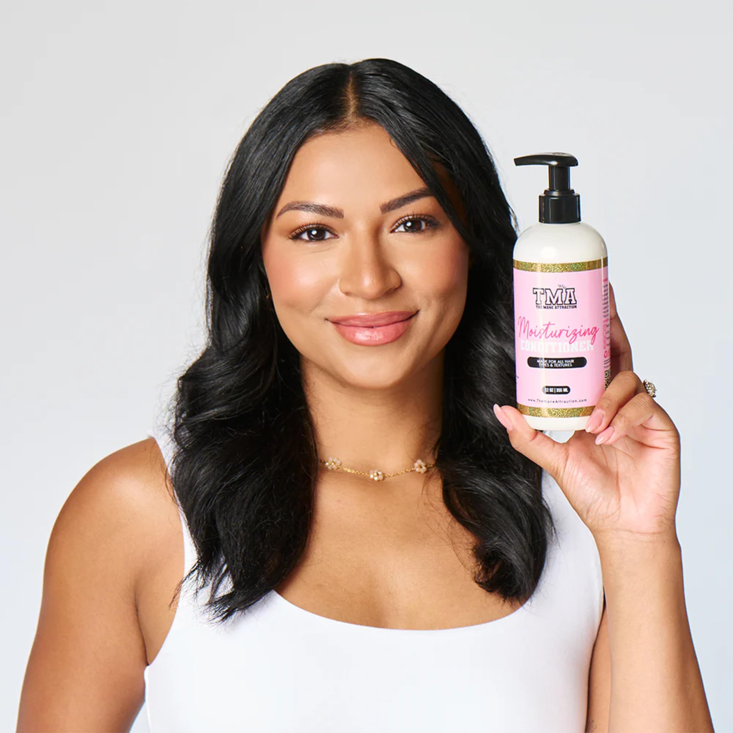 The Mane Attraction Moisturizing Conditioner texture swatch reveals creamy, non-greasy feel
