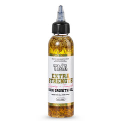 The Mane Attraction Rosemary Fenugreek Oil bottle supports scalp nourishment.
