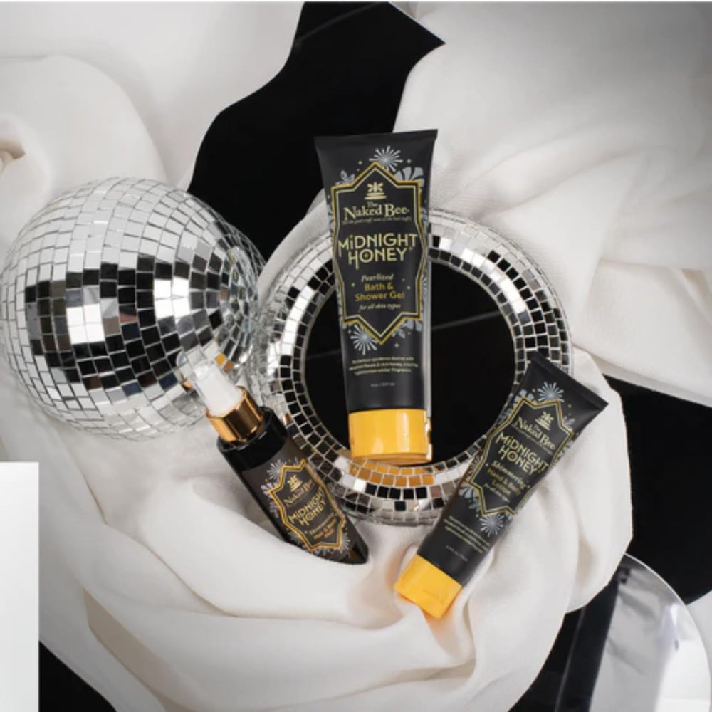 Pouring The Naked Bee Midnight Honey bath gel delivers a creamy lather.