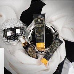 Pouring The Naked Bee Midnight Honey bath gel delivers a creamy lather.