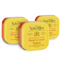 The Naked Bee orange blossom hand salve pack shot with three tins for soothing dry hands