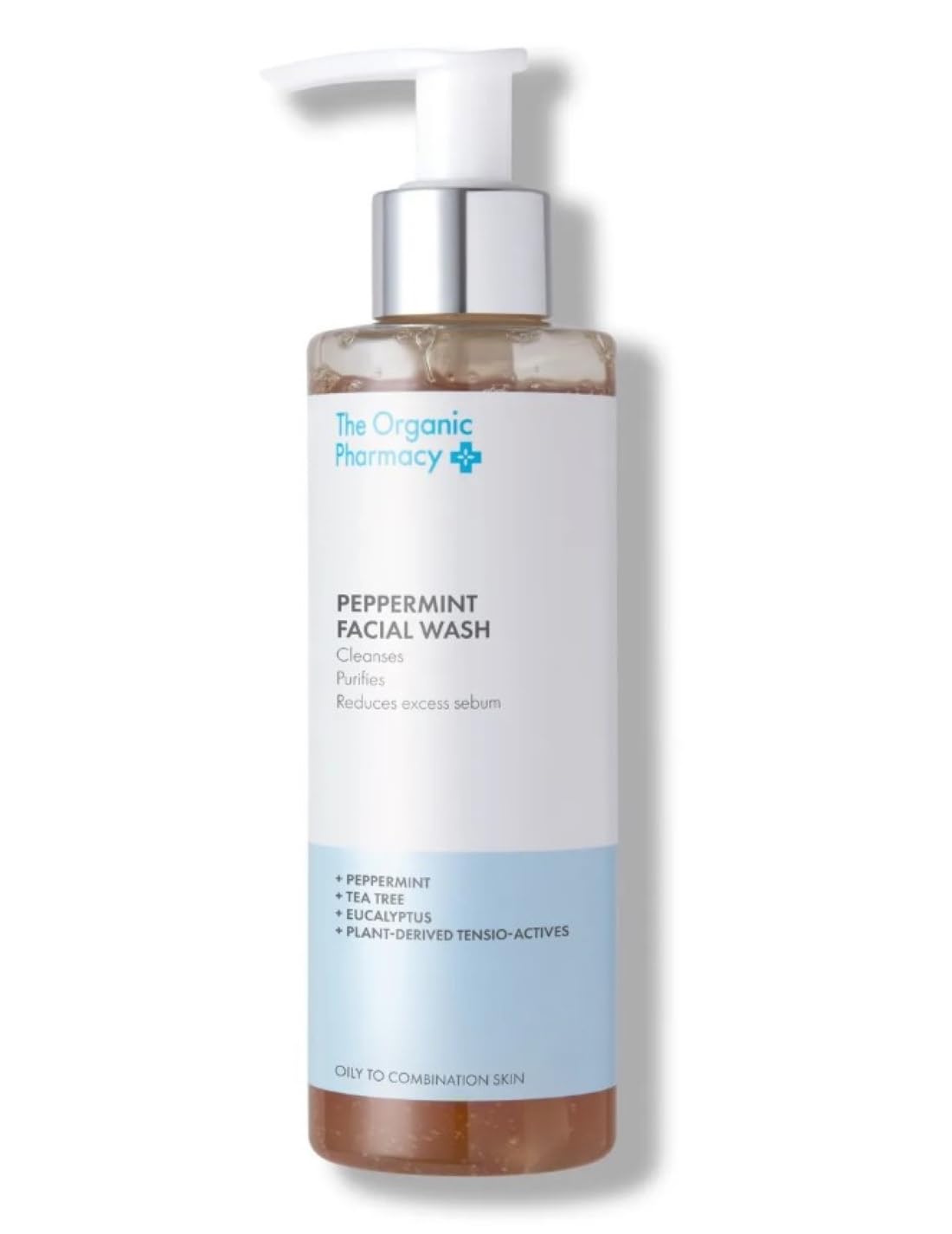 The Organic Pharmacy Peppermint Facial Wash bottle pouring for a refreshing cleanse on oily skin.